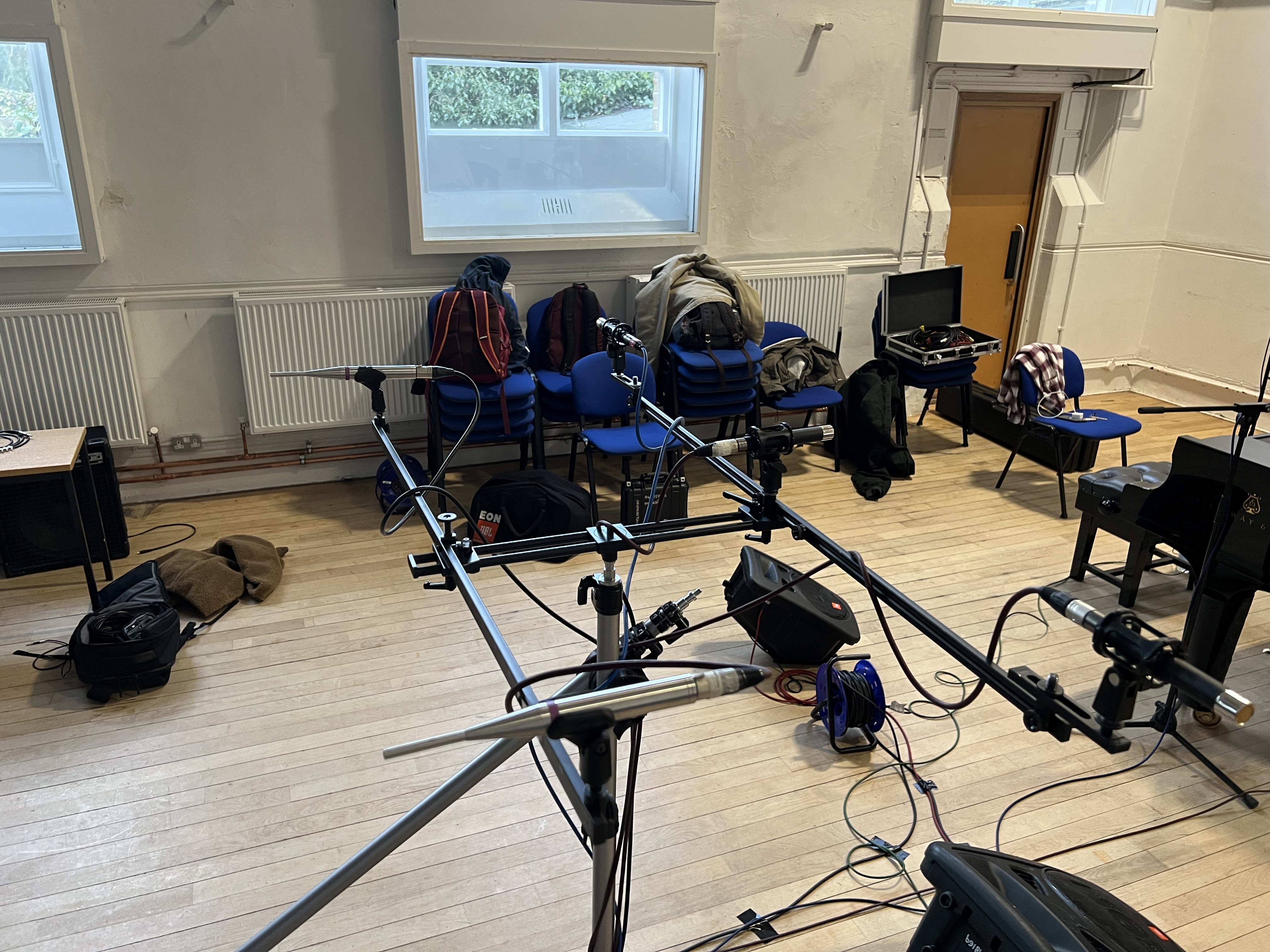 5 microphones mounted to a decca tree stand.