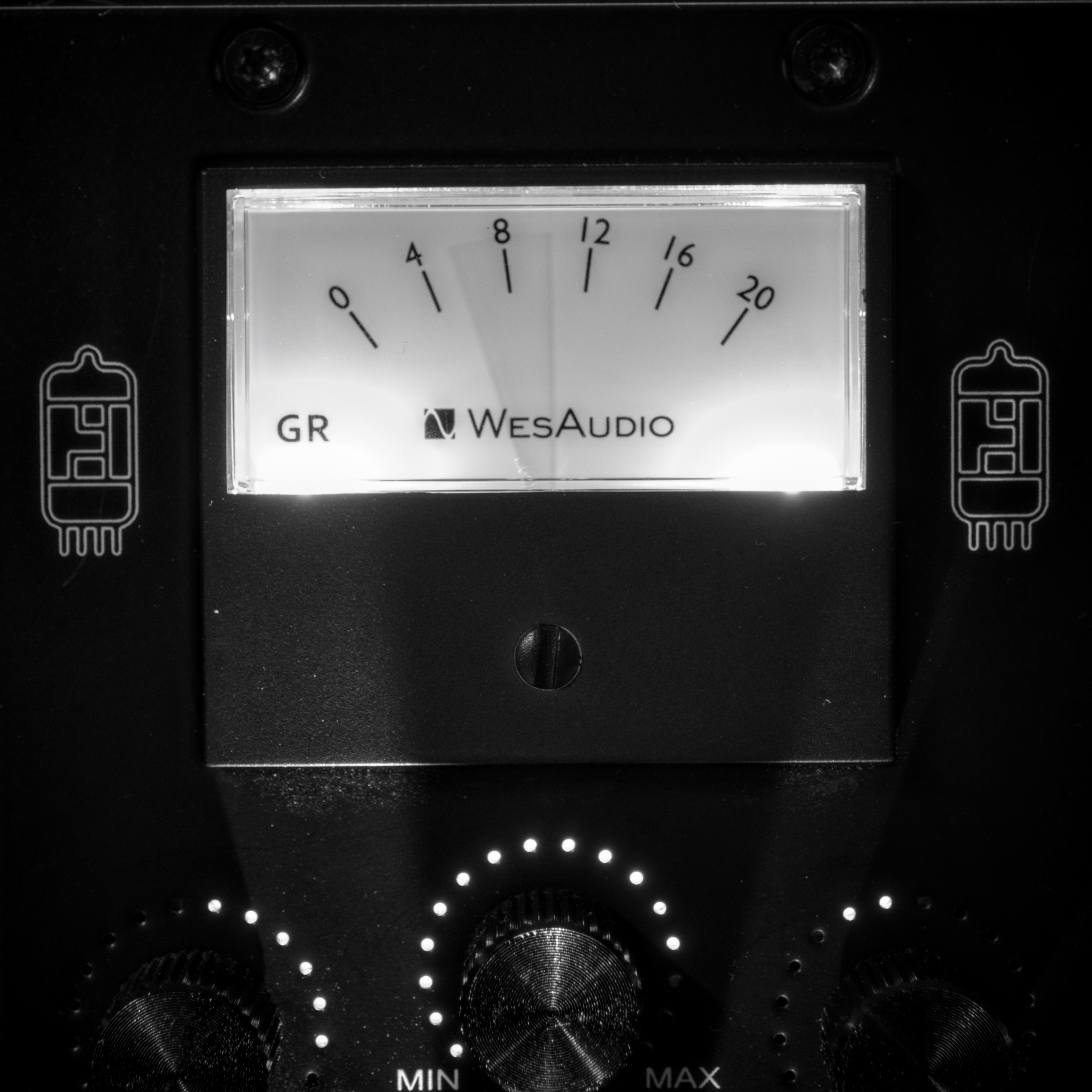 A compressor VU meter, with dramatic lighting from underneath